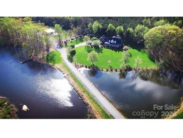 Scenic aerial view of a house situated between two serene ponds at 1011 Ratchford Rd # Lot 1&2, York, SC 29745