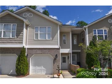 Charming two-story townhome with attached garage and landscaped front yard at 108 Sherman Oaks St, Mooresville, NC 28115