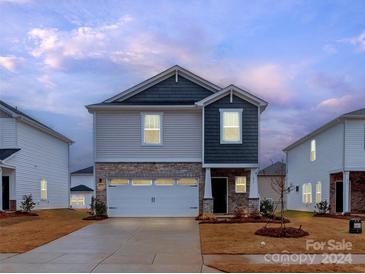 Charming two-story home with a welcoming front porch and attached two-car garage at 1244 31St St # 6, Conover, NC 28613