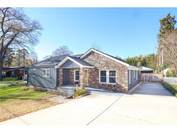 Charming craftsman style home with stone and gray siding at 808 Mark St, Belmont, NC 28012