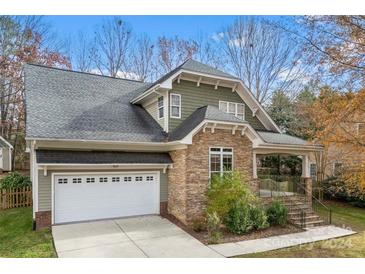 Craftsman style home with stone accents and a two-car garage at 7708 Spanish Oaks Dr, Waxhaw, NC 28173