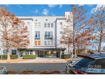 Modern three-story building with parking and landscaping at 914 Westmere Ave, Charlotte, NC 28208