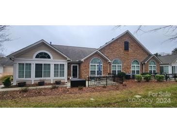 Exterior view of back of house, patio, and fenced yard at 132 Lone Oak Cir, Rock Hill, SC 29732