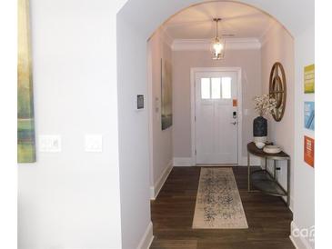 Bright entryway with hardwood floors and stylish decor at 405 Newstyle Way # 1, Cramerton, NC 28056