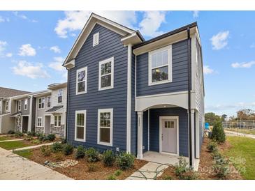 Two-story home with navy siding, white trim, and a gray door at 2005 Near Point Rd # 22, Charlotte, NC 28208