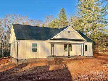 Newly constructed home with white siding, dark roof, and a front porch at 344 C I Chapman Ct, Taylorsville, NC 28681