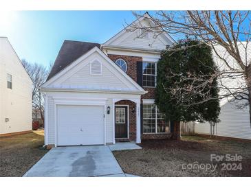 Brick front two-story house with attached garage and landscaping at 2427 Normancrest Dr, Charlotte, NC 28270