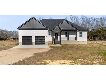 Two-story home with gray roof and two-car garage at 7510 Water Oak Ln, Monroe, NC 28110