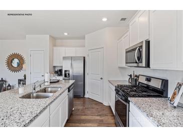 Modern kitchen featuring granite countertops and stainless steel appliances at 883 Two Brothers Ln, York, SC 29745