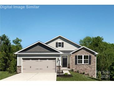 Curb appeal abounds in this charming craftsman style home, featuring a three-car garage at 605 Nesbe St # 2228, Lancaster, SC 29720