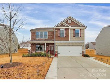 Two-story house with a neutral color scheme and a two-car garage at 6416 Ellimar Field Ln, Charlotte, NC 28215