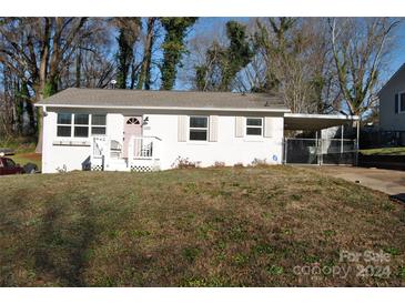 Charming ranch home with white brick exterior and carport at 208 Nila Dawn Ave, Gastonia, NC 28052