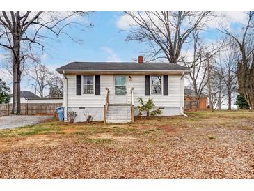 White bungalow with black shutters, steps, and small yard at 110 1/2 Shamrock Ct, Fort Mill, SC 29715