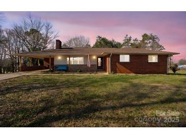 Brick ranch house with covered porch, and a spacious yard at 4331 Sulphur Springs Ne Rd, Hickory, NC 28601