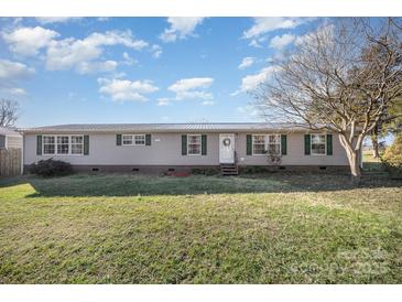 Ranch style home with green shutters and a spacious lawn at 6470 Long Branch Rd, Salisbury, NC 28147