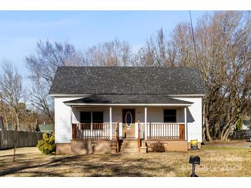 White house with gray roof, front porch, and small yard at 1716 Maxton Ave, Gastonia, NC 28052