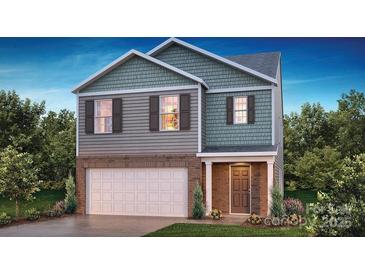 Two-story home with gray siding, brick accents, and a two-car garage at 8055 Plymouth Dr, Sherrills Ford, NC 28673