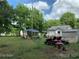 Large backyard with two lawn tractors and a shed at 507 North Dr, Cherryville, NC 28021