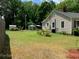 Large backyard with a shed, patio furniture and lawn at 507 North Dr, Cherryville, NC 28021
