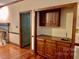 Built-in wet bar with wood cabinets and granite countertop at 298 Shadowbrooke Ln, Mooresville, NC 28117
