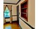Home office featuring built-in shelving and hardwood floors at 298 Shadowbrooke Ln, Mooresville, NC 28117