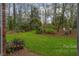 Landscaped backyard with lush greenery and garden features at 3011 Paraham Rd, York, SC 29745