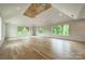 Large bedroom with hardwood floors, high ceilings, and abundant natural light at 8010 Litaker Manor Ct, Charlotte, NC 28270