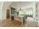 Modern kitchen with double islands, green cabinets, and marble countertops at 8010 Litaker Manor Ct, Charlotte, NC 28270