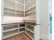 Bright corner pantry with custom shelving and dark quartz countertop at 8010 Litaker Manor Ct, Charlotte, NC 28270