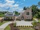 Luxury home with brick exterior, large driveway, and landscaped yard at 8010 Litaker Manor Ct, Charlotte, NC 28270