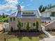 Brick home with metal roof, landscaping, and walkway at 8010 Litaker Manor Ct, Charlotte, NC 28270