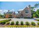Brick front exterior of a two-story home with landscaping and a large driveway at 8010 Litaker Manor Ct, Charlotte, NC 28270