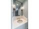 Powder room with unique vessel sink and elegant wall sconces at 8010 Litaker Manor Ct, Charlotte, NC 28270