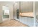 Walk-in pantry with wine cooler, custom cabinetry, and dark quartz countertop at 8010 Litaker Manor Ct, Charlotte, NC 28270