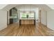 Large kitchen with two islands, green cabinets, and marble countertops at 8010 Litaker Manor Ct, Charlotte, NC 28270