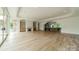 Spacious living area with hardwood floors, fireplace and views to kitchen at 8010 Litaker Manor Ct, Charlotte, NC 28270