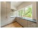 Butler's pantry with ample storage, quartz countertop, and large window overlooking backyard at 8010 Litaker Manor Ct, Charlotte, NC 28270