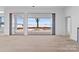 Living area with expansive windows offering lake views at 8397 Ranger Island Marina Rd, Denver, NC 28037