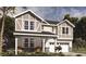 Two-story home with a large front porch at 1503 Laggan Ln # 58- Gaines Td, Indian Trail, NC 28079