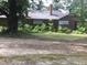 Brick house with awnings and overgrown landscaping at 510 & 516 & 520 N Matson N Matson St, Kershaw, SC 29067