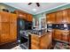 Eat-in kitchen with stainless steel appliances and ample counter space at 317 W Front St, Statesville, NC 28677