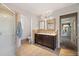 Bathroom with double vanity, shower, and tile flooring at 525 Kelly Ave, Mooresville, NC 28115