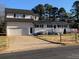 House exterior showcasing a two-car garage and front porch at 525 Kelly Ave, Mooresville, NC 28115