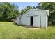 White storage shed with double doors in the backyard at 525 Kelly Ave, Mooresville, NC 28115