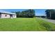 Small house with a large grassy yard, located on a road with trees at 1672 Riverview Rd, Lincolnton, NC 28092