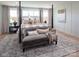 Serene bedroom with a comfortable four-poster bed and a cozy sitting area at 11330 James Coy Rd # Covington, Davidson, NC 28036