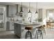 Spacious kitchen with gray cabinets, an island, and modern pendant lighting at 11330 James Coy Rd # Covington, Davidson, NC 28036