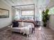 Bright and airy bedroom featuring a four-poster bed and a tranquil sitting area at 11330 James Coy Rd # Covington, Davidson, NC 28036