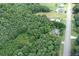 Aerial view of property with road access and surrounding woodland at 4020 S Nc Hwy 127 Hwy, Hickory, NC 28602