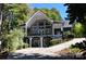 Two-story home with a large, covered deck and a spacious driveway at 3645 Lake Bluff Dr, Sherrills Ford, NC 28763
